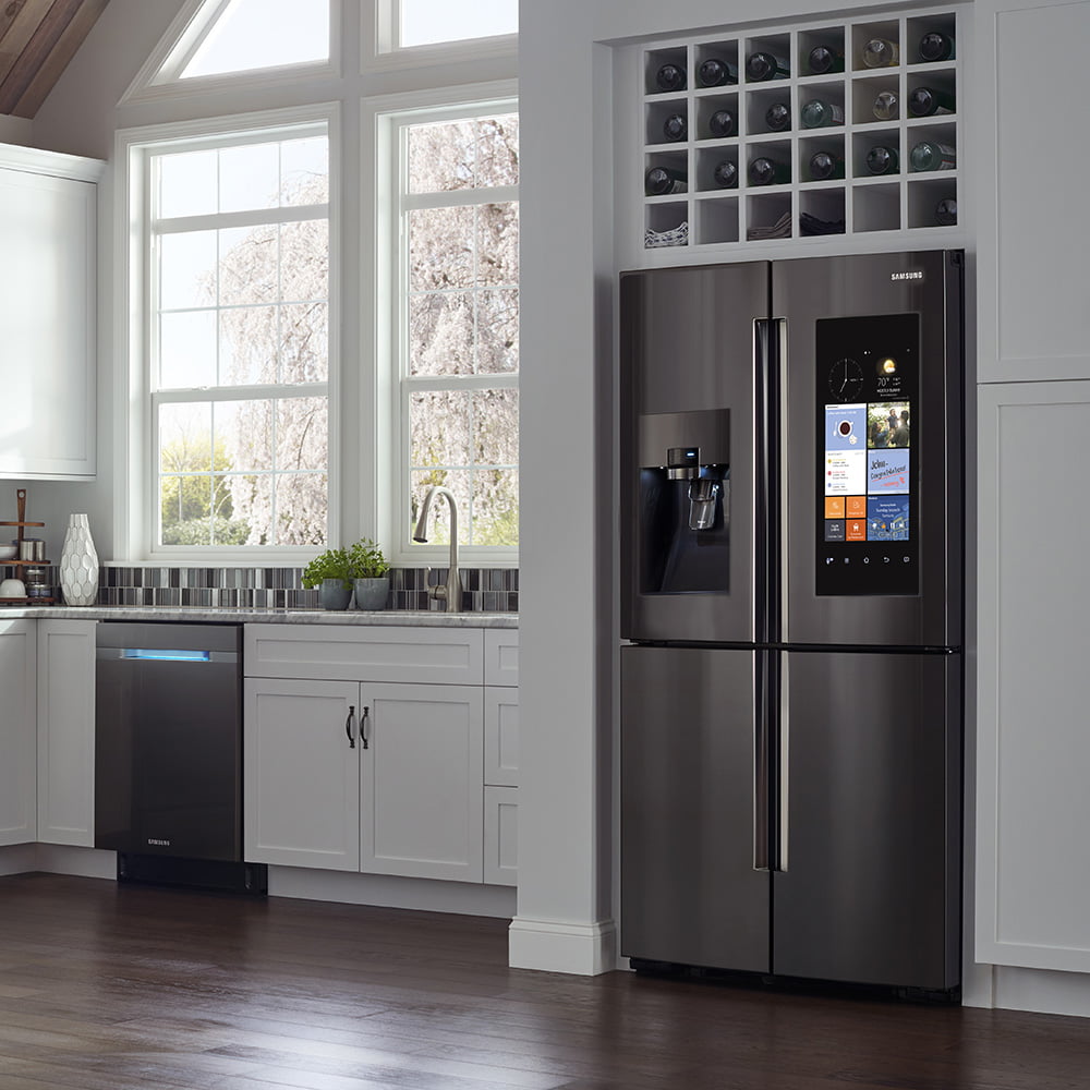 Samsung fridge elegantly installed in a pristine kitchen space.